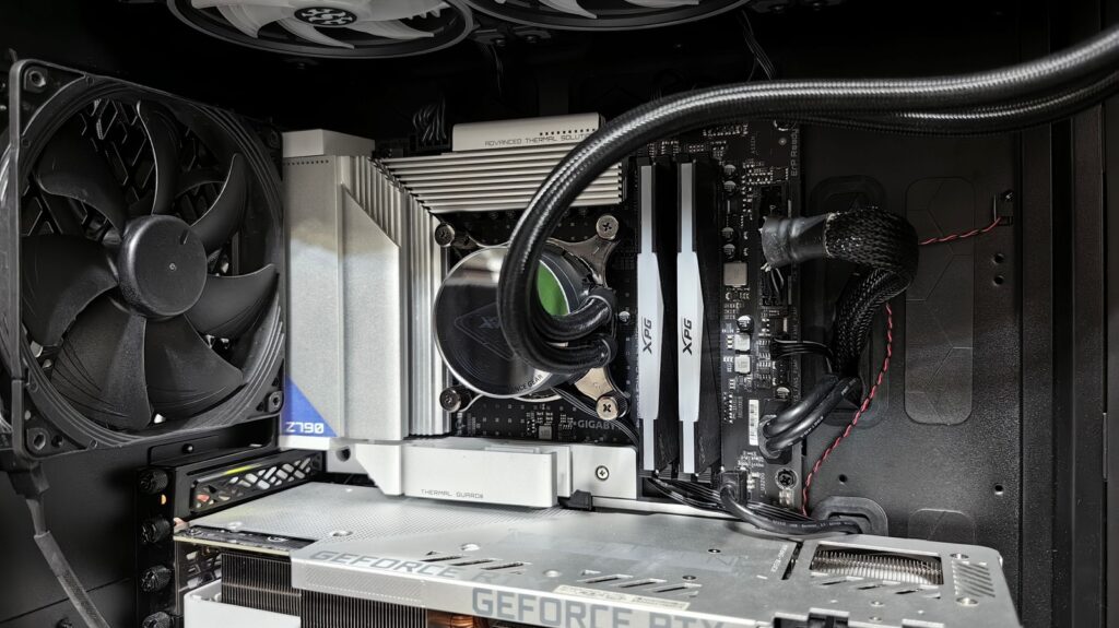 Gaming PC interior showing CPU cooler, RAM and GeForce RTX GPU