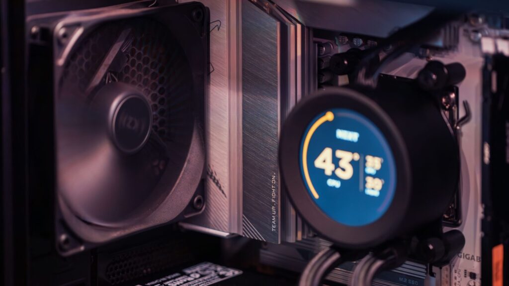 CPU AIO pump display showing temperatures inside a PC case