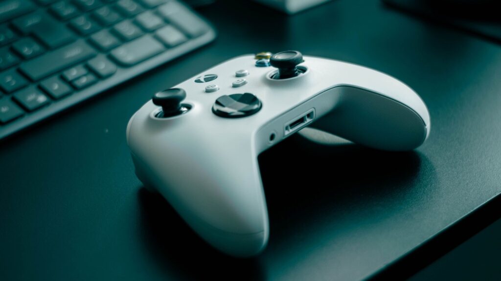 White gaming controller on a desk