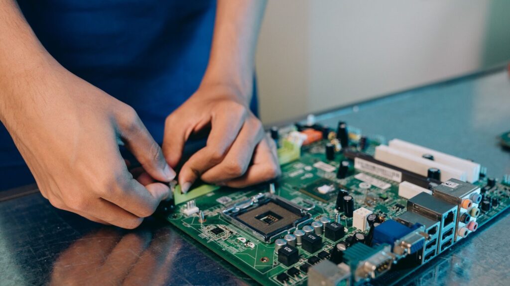 Technician working on a motherboard